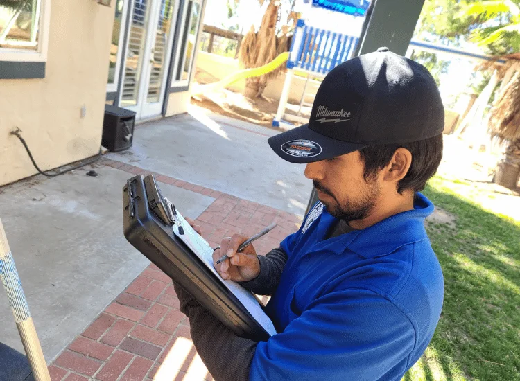 Pest control expert Ricardo from ER Pest and Termite in San Bernardino, CA does an inspection